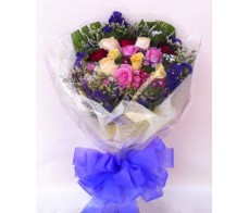 F35 18 PCS MULTI COLOUR ROSES WRAPPED IN ROUND 